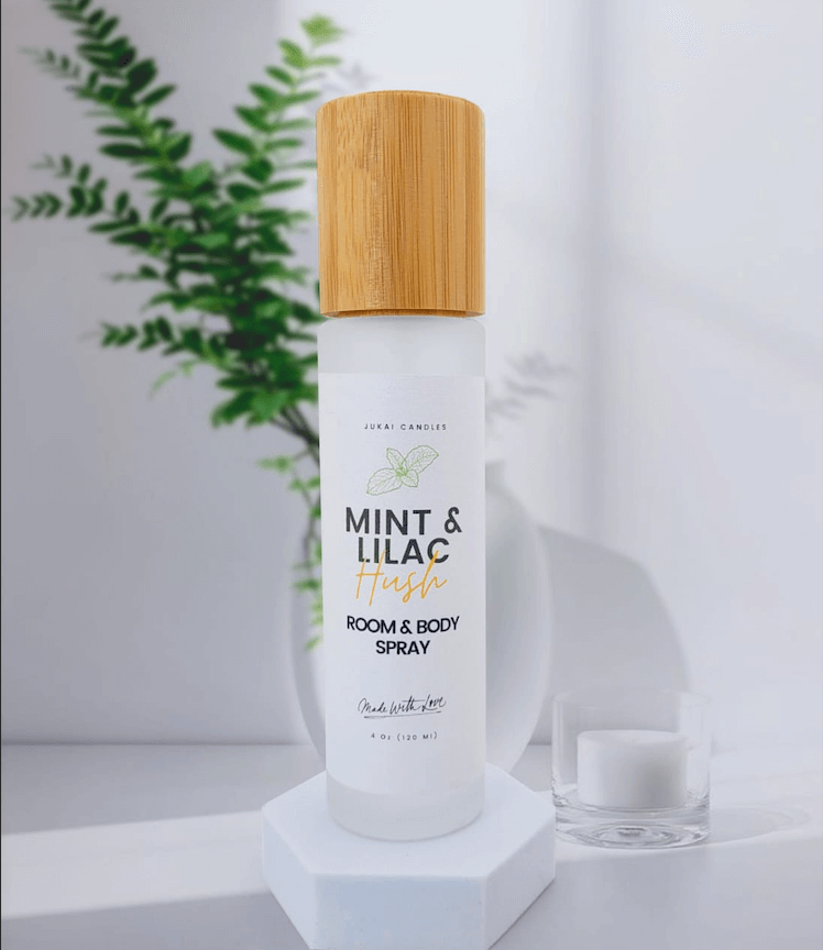 Room and body spray with a wooden cap on a white background