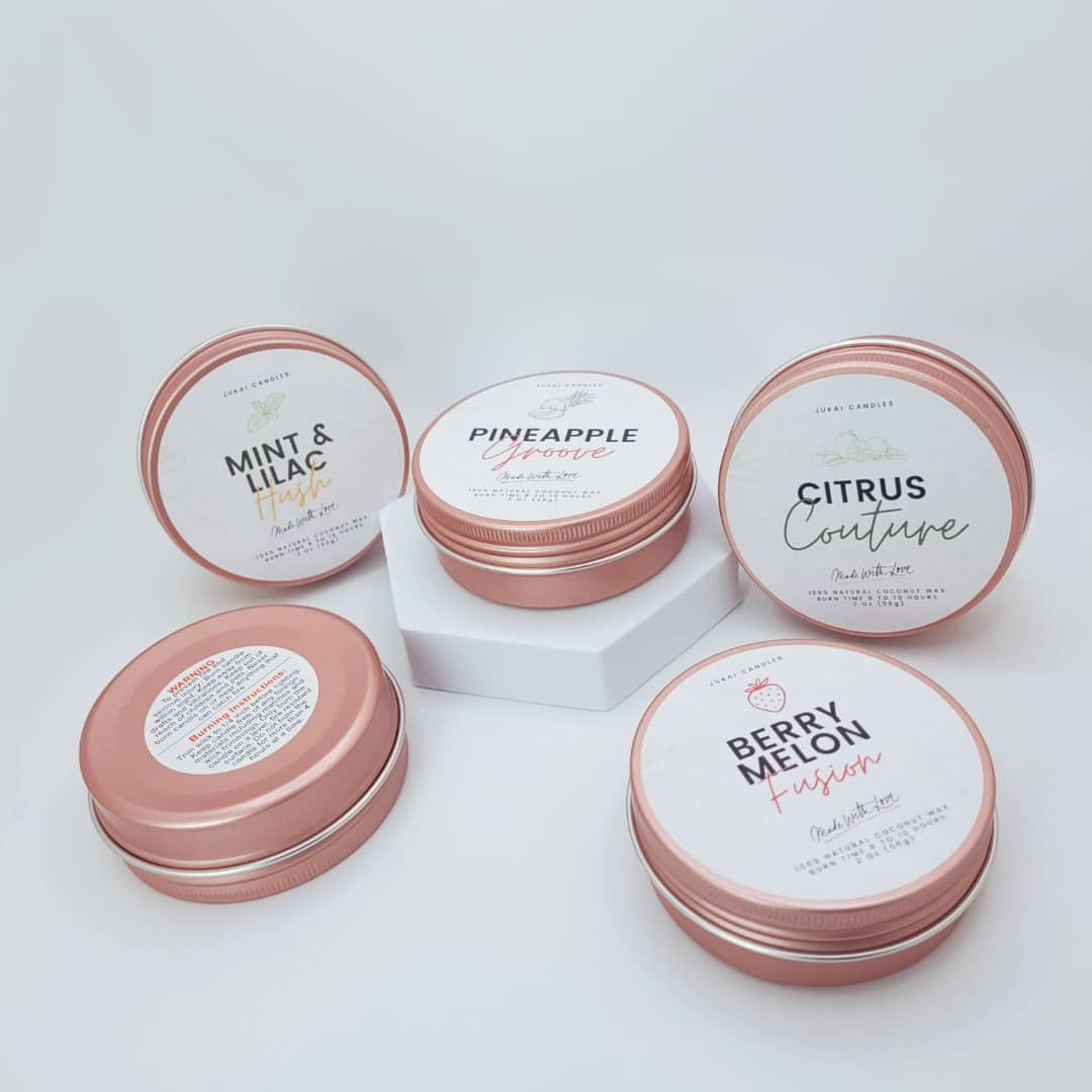 Set of small containers with lids on a light gray background