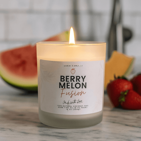 Candle labeled 'Berry Melon Fusion' with a watermelon and strawberries in the background